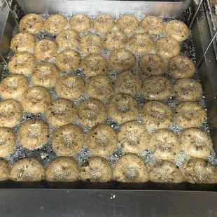 a frying pan filled with doughnuts