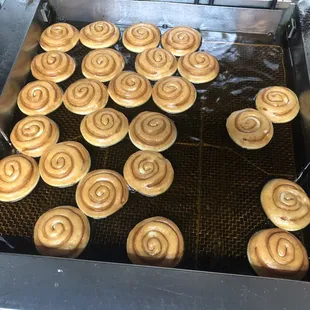 a bunch of doughnuts being made