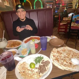 Great smiles all around i mean can you blame me ?Look at all this DELICIOUS food. Tacos are finger licking good.