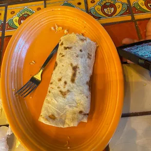 HALF of a bacon, egg and potato burrito! It&apos;s huge!!