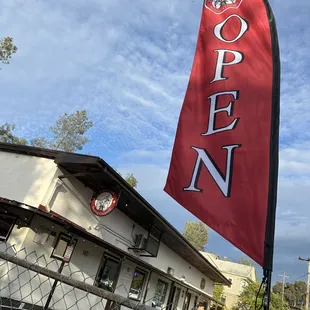 Big red flag to help find the parking lot which is behind Old Town Pizza's building