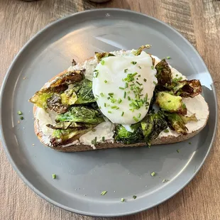 Fried brussels sprouts toast w/whipped goats cheese and a poached egg on top