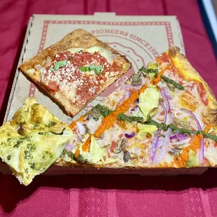 Spinach-artichoke bombini, Grandma Bess square and V For Vegan slice.