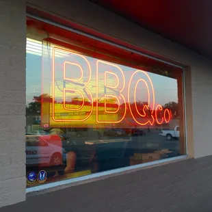 a neon sign in the window
