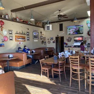 Entry looking at bathrooms, TV and booths