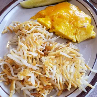 Scrambled eggs with cheddar, blondish hash browns and the pickle from the chicken melt.  Decent dill pickle.
