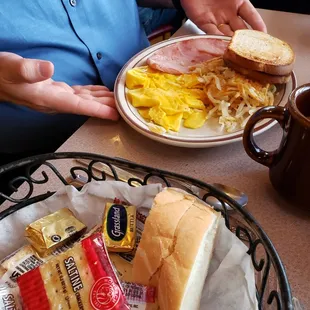 Just as it looks, ham, eggs, hash browns and wheat toast.  Bread in the foreground came with the dinner.