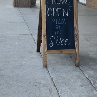 a sign for a pizza place