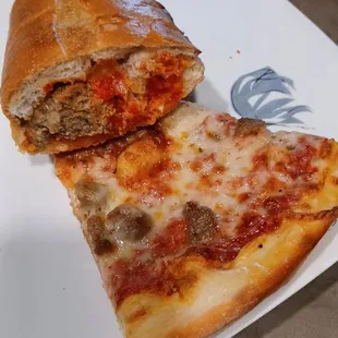 Part of a meatball sandwich and slice of sausage pizza