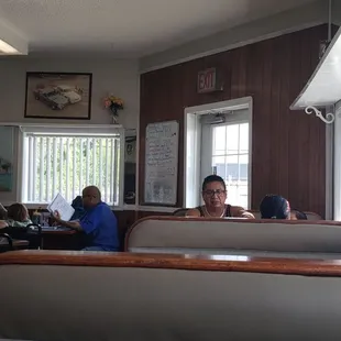 a man sitting at a table in a restaurant