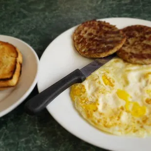 a plate of eggs, toast and toast