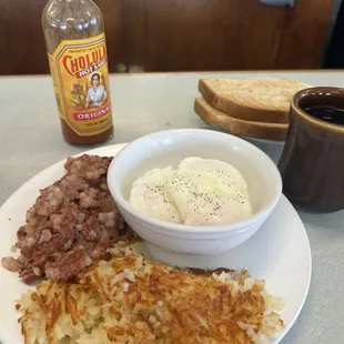 Corned beef hash, poached eggs, hash browns and rye toast