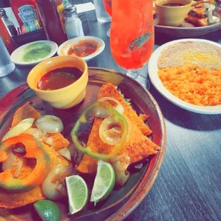 Quesa Birria And A Side Portion of Rice And Beans...!  On The Side A Freshly Cut Strawberry Mojito...