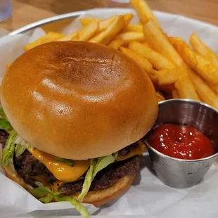 Smashburger with French fries.. need more ketchup.
