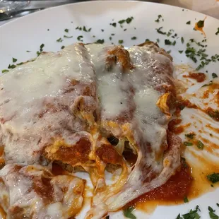 Eggplant parmigiana with side of spaghetti.