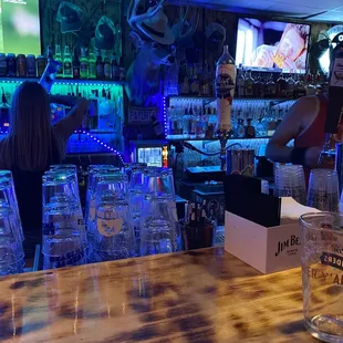 a woman behind the bar