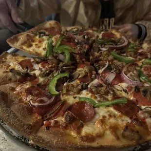 Grab me a big slice of that supreme pizza please!  Hot and delicious