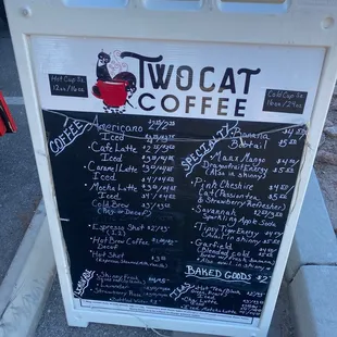 a menu on a sidewalk