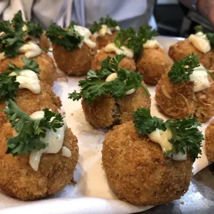 a tray of deep fried meatballs