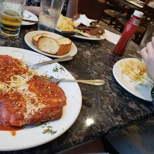 Veal parm, gyro sandwich in background