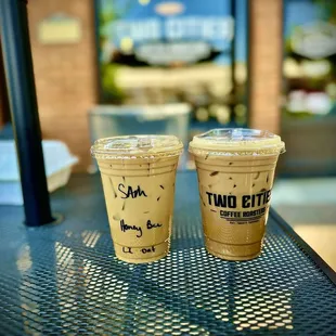 Honey Bee iced oatmilk latte and Penguin iced Oatmilk latte.