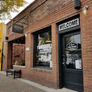a brick building with a welcome sign