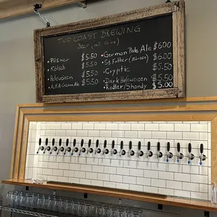 a blackboard with a list of beers