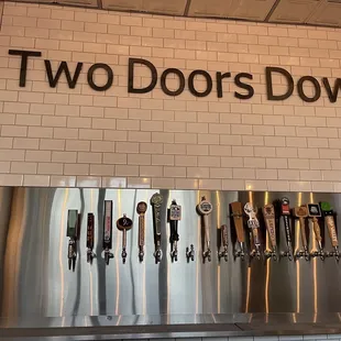 a row of beer taps