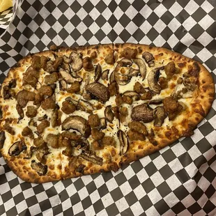 Mushroom pizza with sausage added