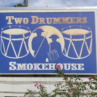a sign for two drummers smokehouse