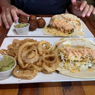 Mahi and grouper tacos with hush puppies and onion straws.