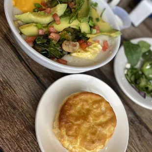 Veggie bowl built on grits with a biscuit