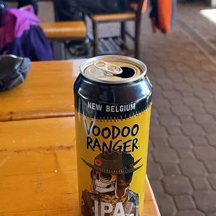 a can of beer on a table