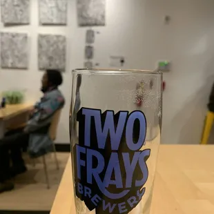 a glass of beer on a table