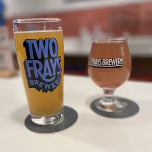 two glasses of beer on a table