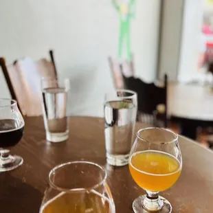 two glasses of beer on a table