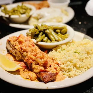Moi got Blackened salmon topped w Valentine's day special tomato cream crawfish sauce, rice &amp; green beans Excellent :)...