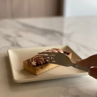 a piece of cake on a plate with a fork