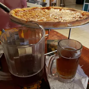 Large delicious pizza and a pitcher of Yuengling