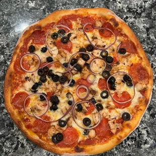  a pepperoni and olive pizza
