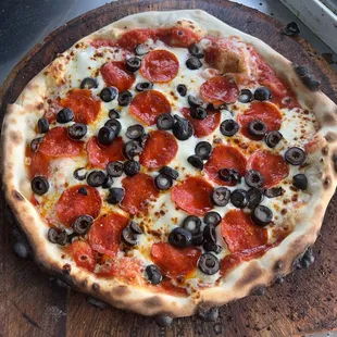  a pepperoni and olive pizza