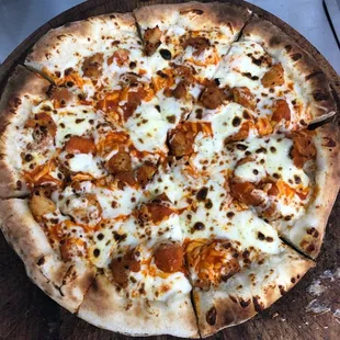  a pizza on a wooden board