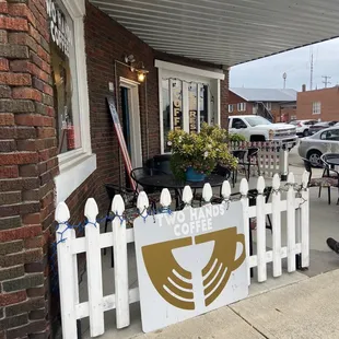 a white picketer and a sign