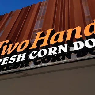 sign for two hands fresh corn dogs