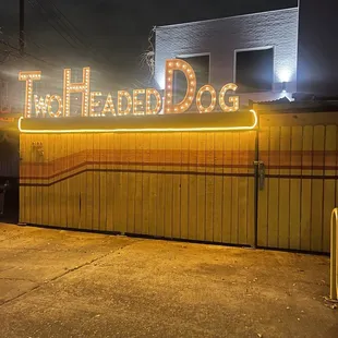 a neon sign in front of a building