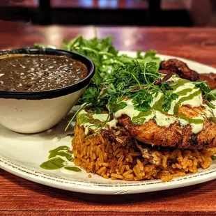 Jollof rice platter with lemon garlic salmon.