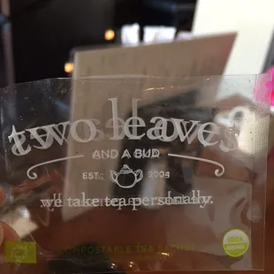 a person holding a tea bag