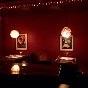 a dimly lit restaurant with red walls