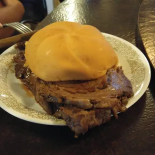 a meat sandwich on a plate