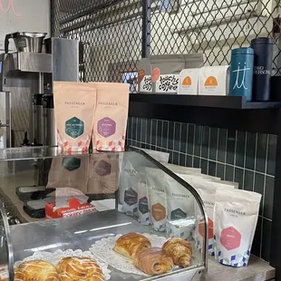 a counter with a variety of pastries